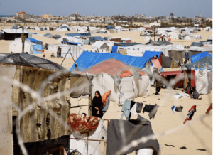 Displaced Palestinians, who fled their houses due to Israeli strikes, shelter at a tent camp, amid the ongoing conflict between Israel and the Palestinian Islamist group Hamas, in Rafah in the southern Gaza Strip, February 29, 2024. REUTERS